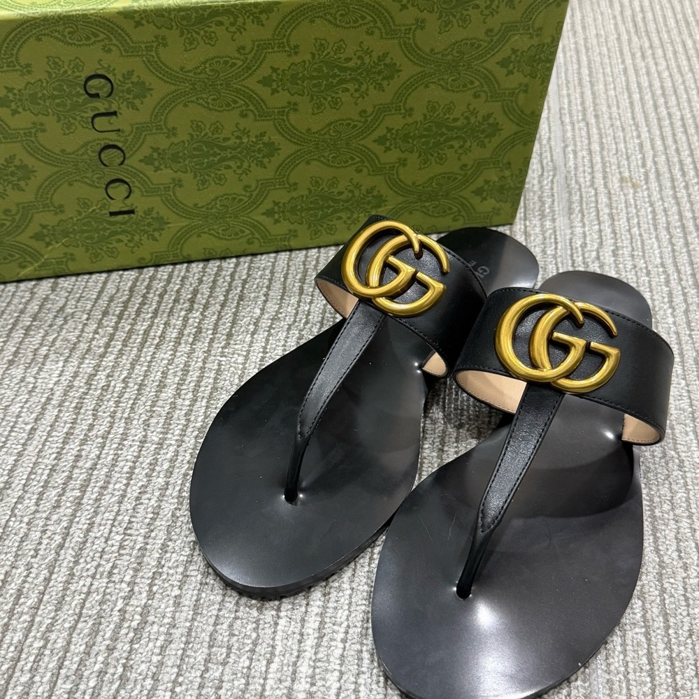 Gucci Women’s Black Slippers.